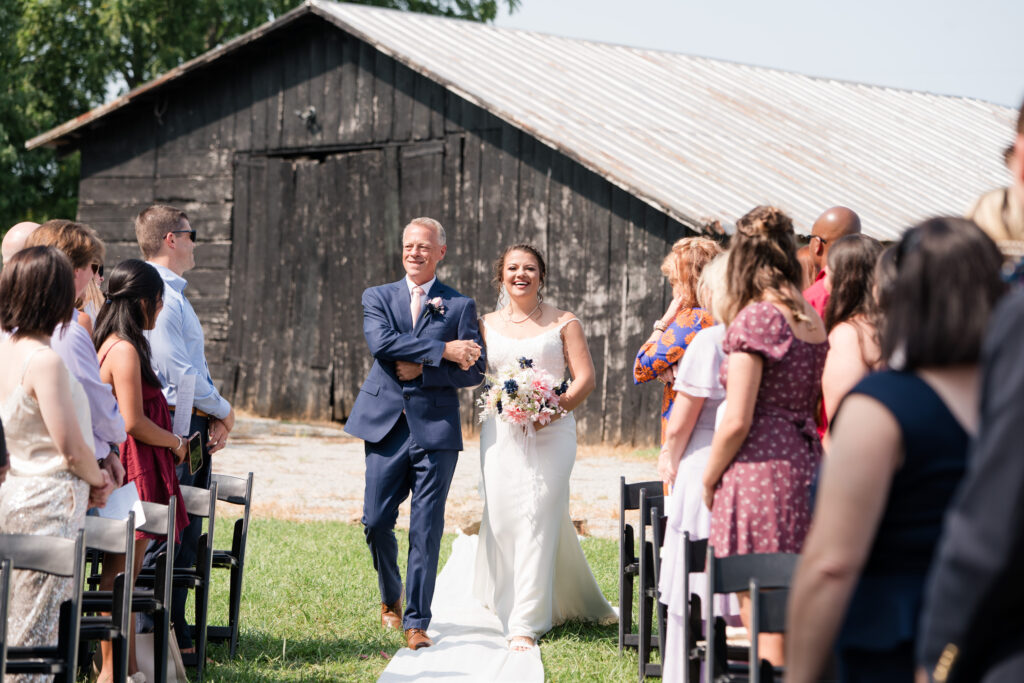 Kentucky wedding bride processing down aisle with father 