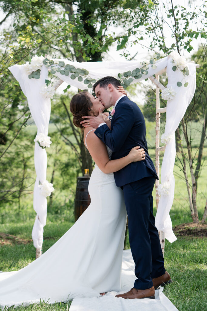 Kentucky wedding photography bride and groom first kiss