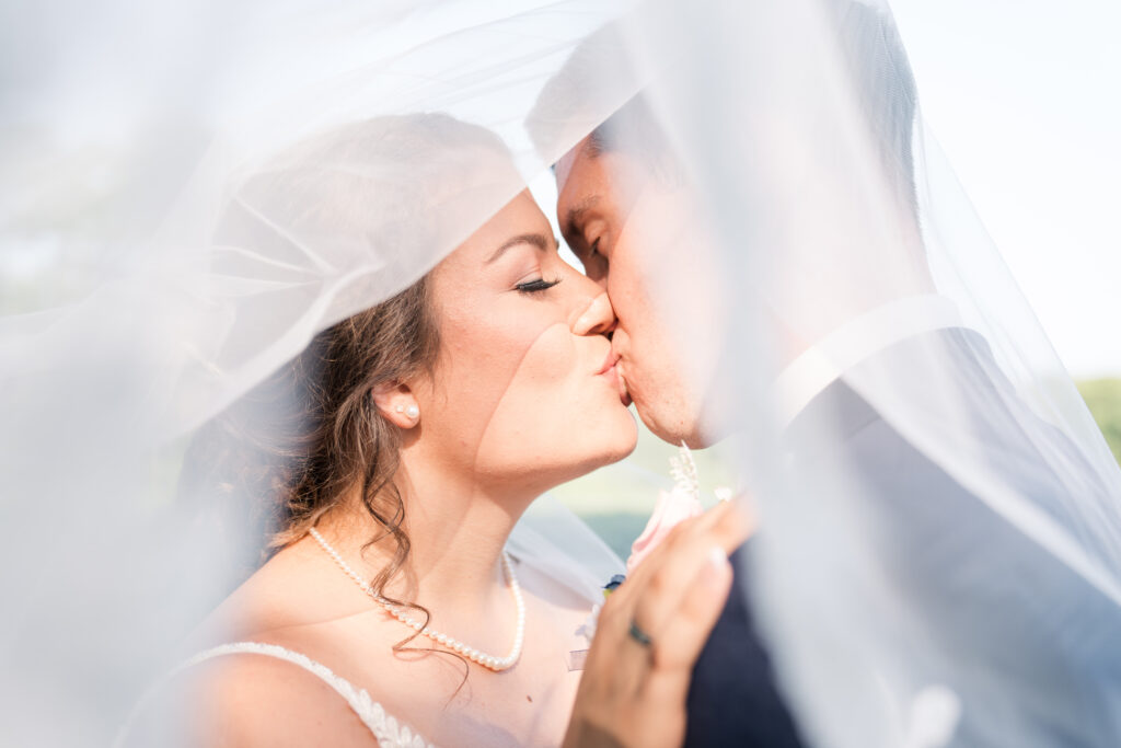 Kentucky Wedding Photography bride and groom kiss under veil 