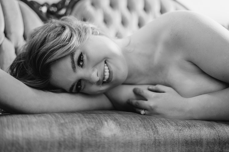 Black and white lying down boudoir model