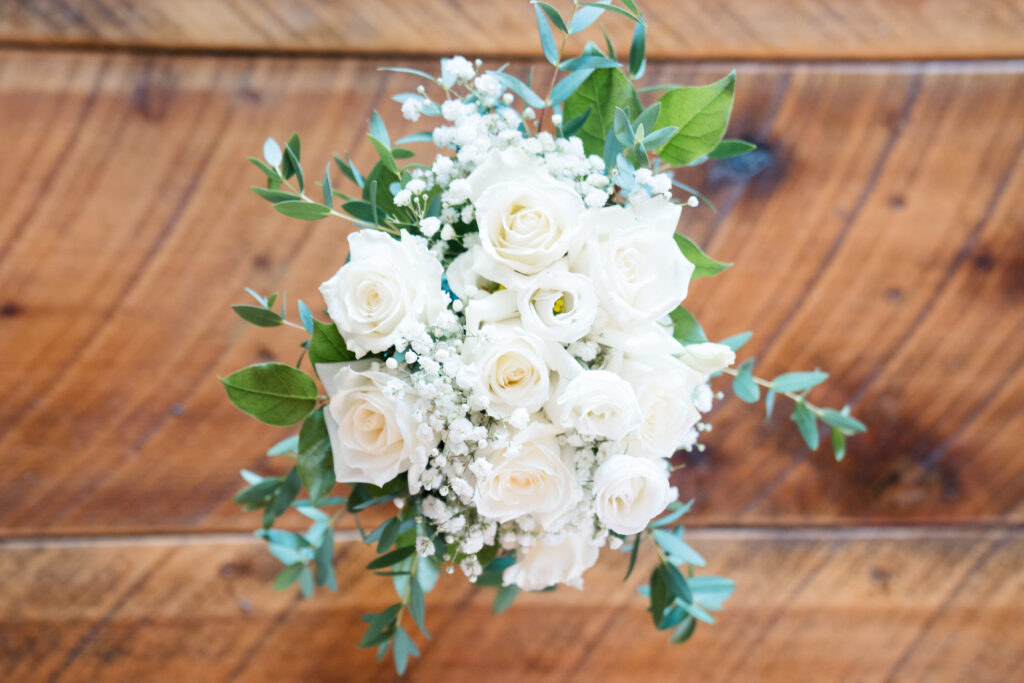 bridal bouquet white roses and greenery