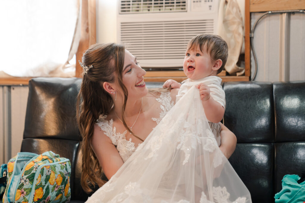 bride with ring bearer summer wedding