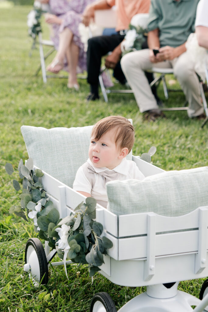 ring bearer in wagon summer wedding