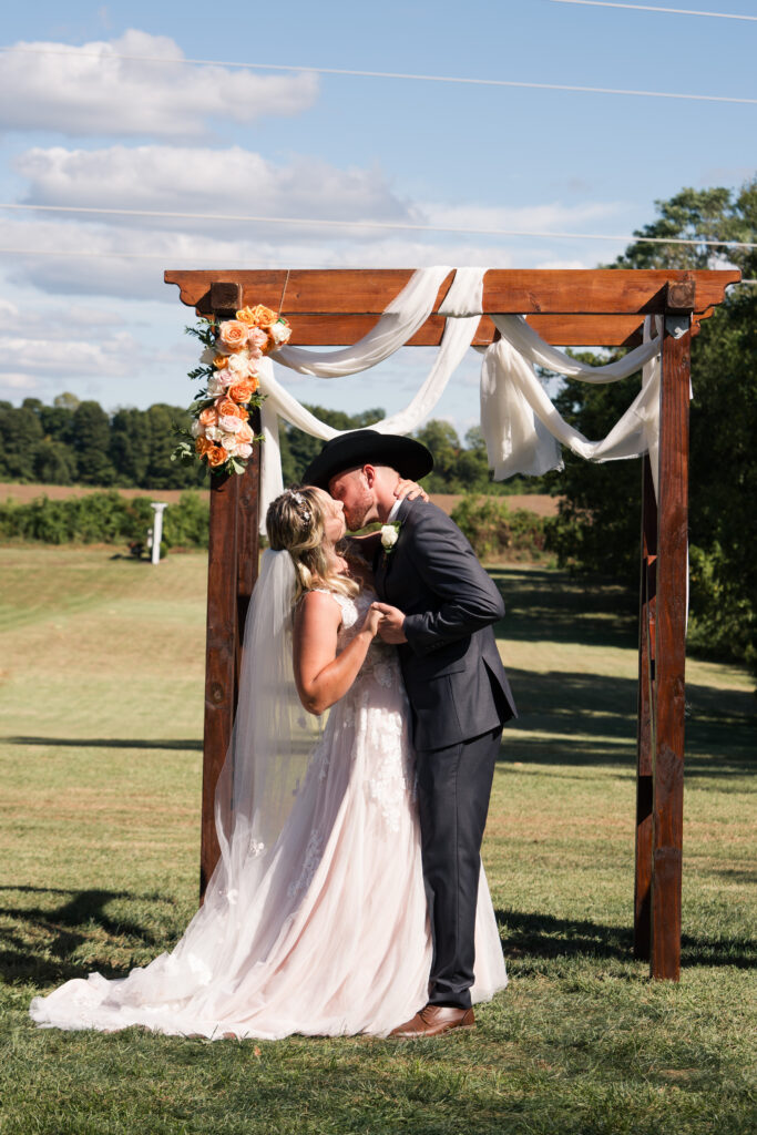 Rustic Barn Wedding First Kiss