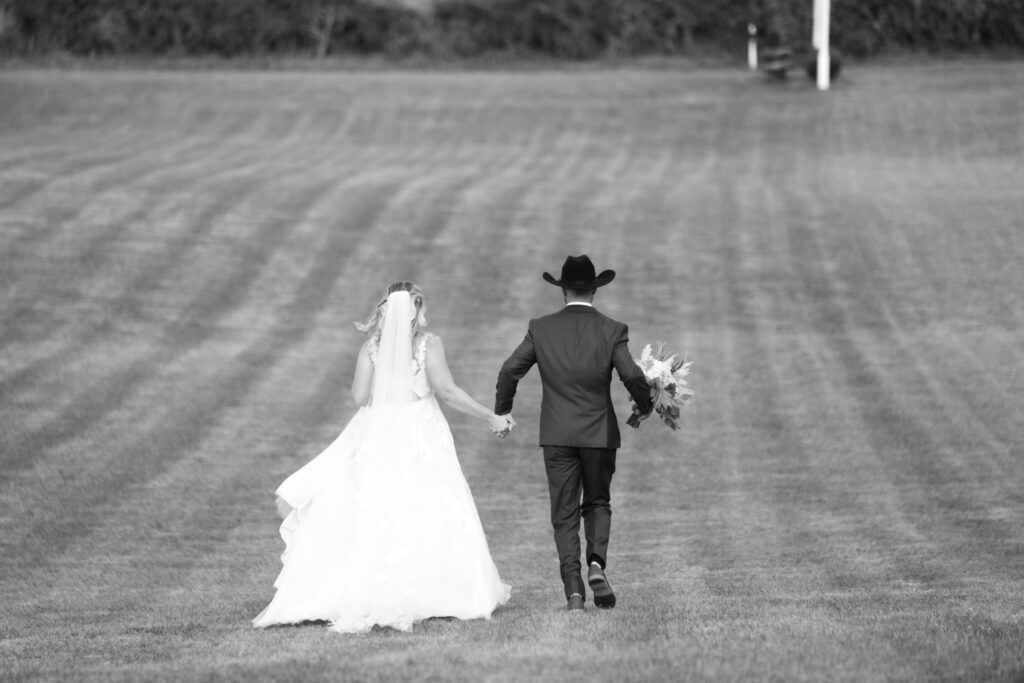 Bride + Groom Running Rustic Barn Wedding 