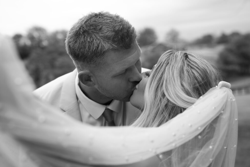 black and white wedding photo with veil